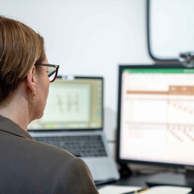 View over Anna's shoulder as she updates a timeline on a sales training spreadsheet